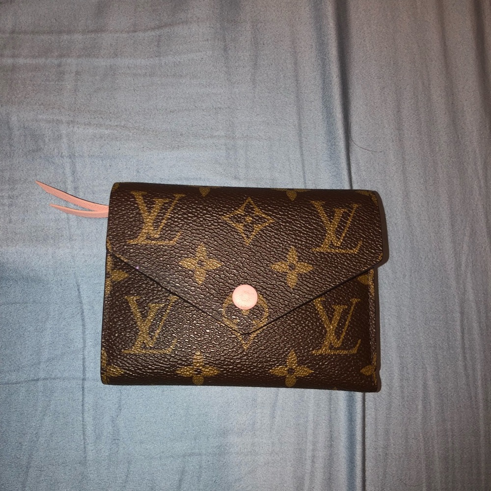 Women’s Louis Vuitton brown leather pink wallet